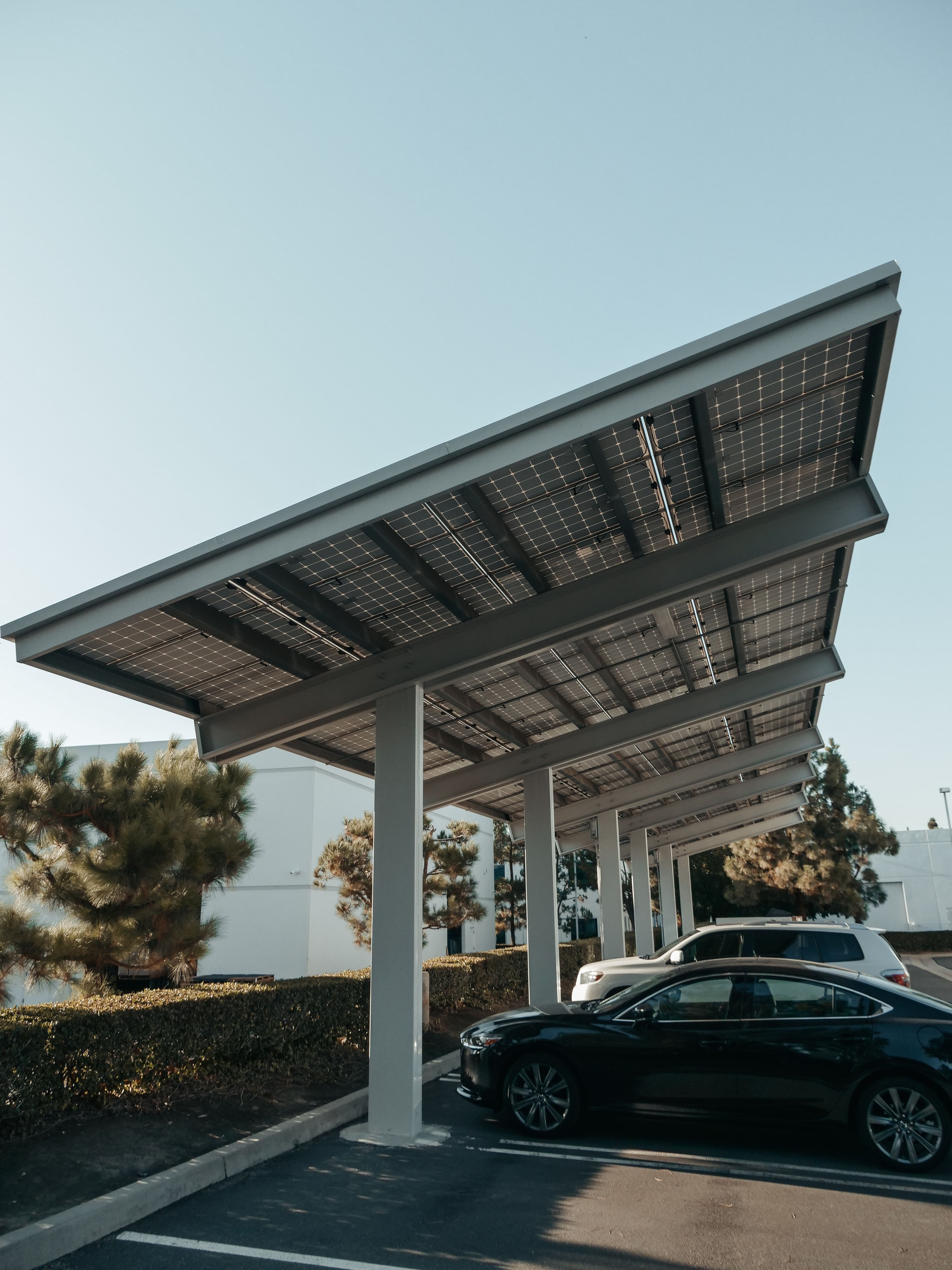 Solar carport structure providing shade and power