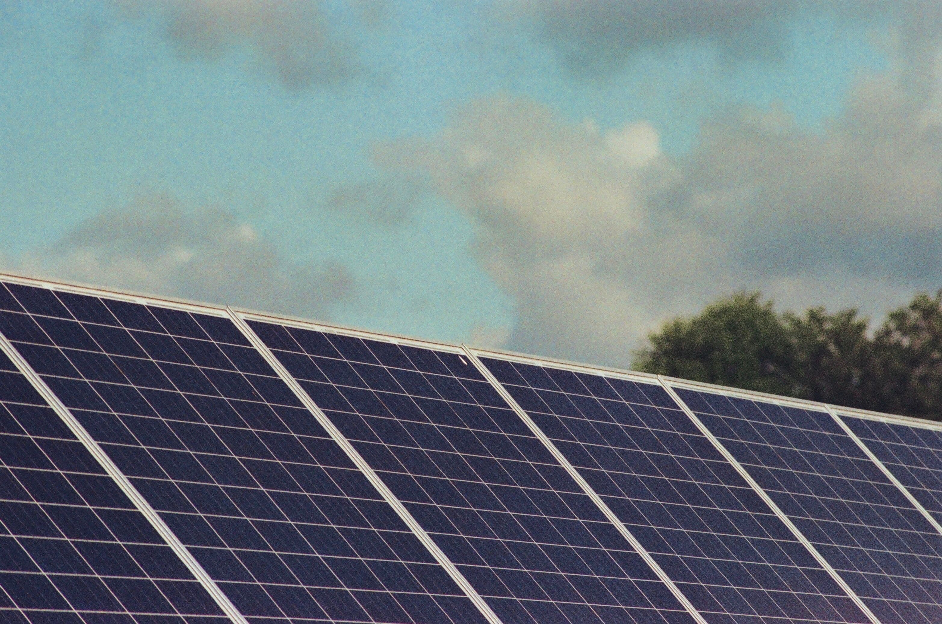 Solar panels generating power under clear daylight