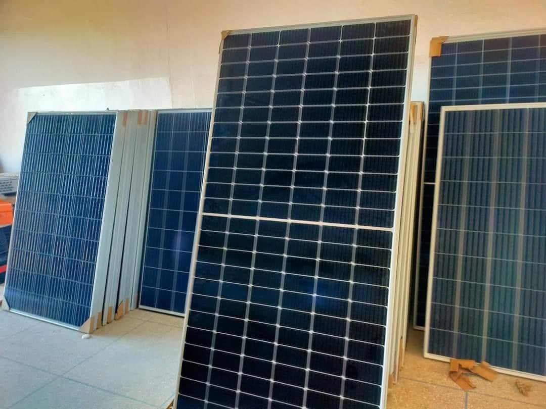New solar panels staged indoors ahead of installation