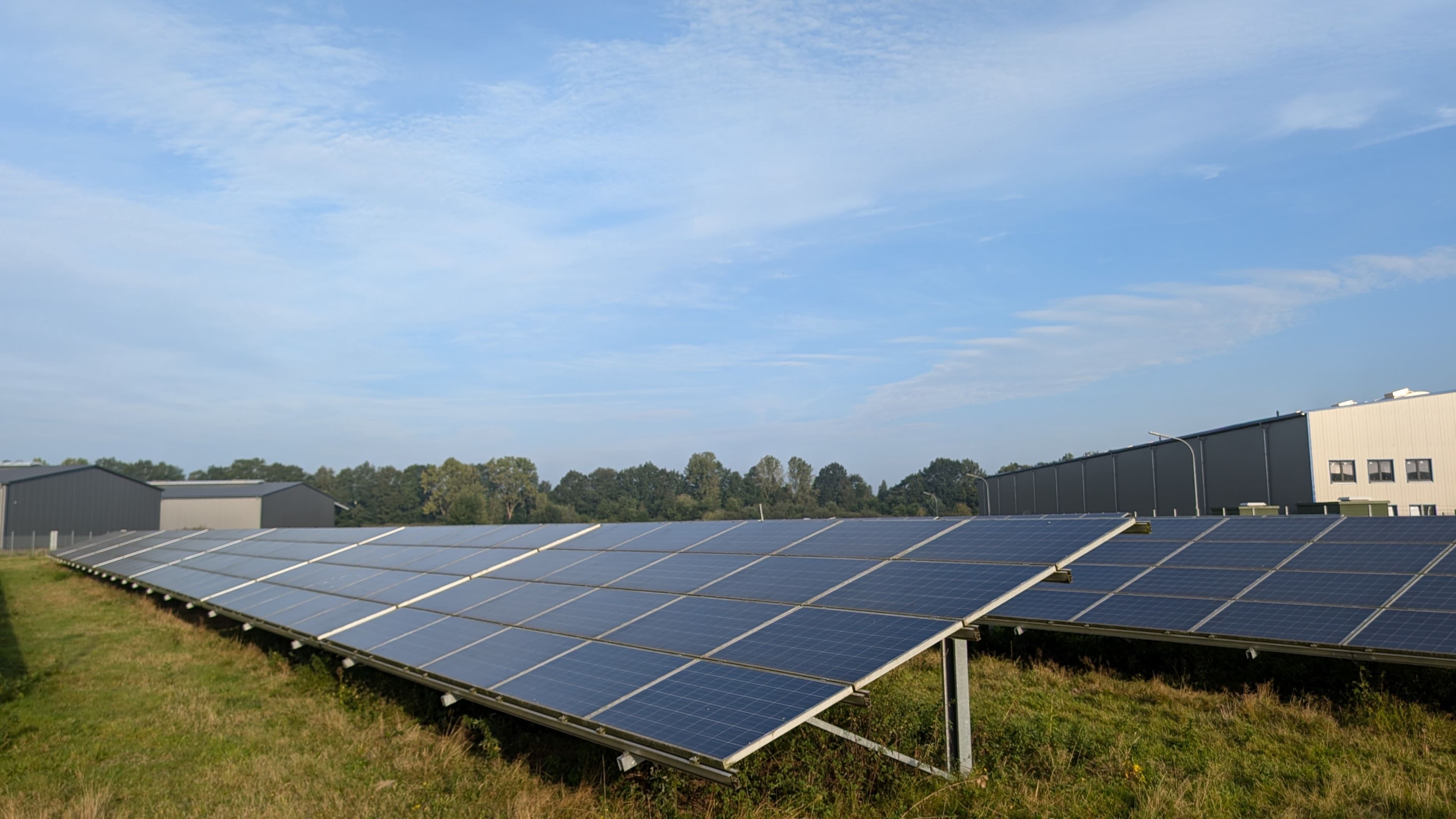 An existing ground-mounted solar array in an open field